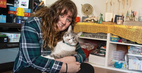 A person holding a cat, A Pet Disaster Preparedness Success:  Quazi and Owner Reunited